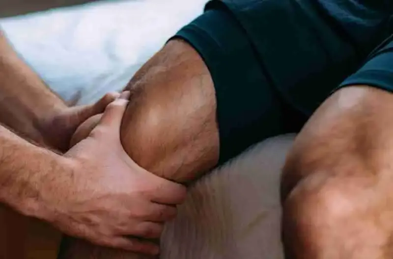 Chair massage of a knee