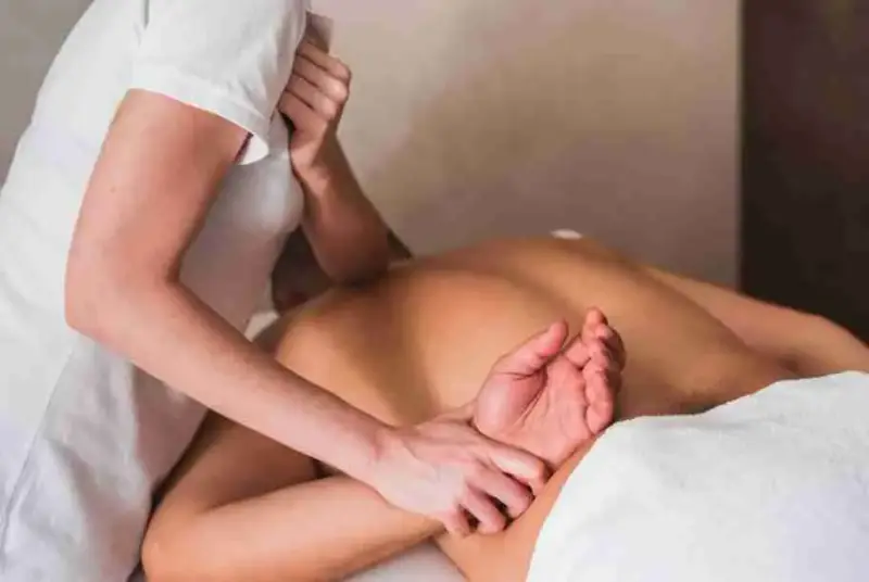 Deep Tissue Massage guy on a massage table