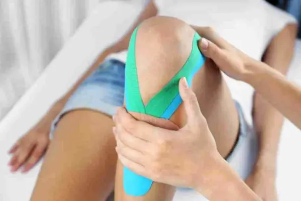 K Tape Rock kinesiology Tape application to a patient's knee