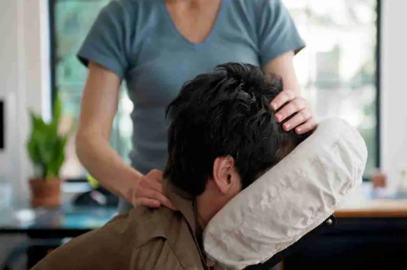 Office Chair Massage A person receiving a chair massage in an office setting